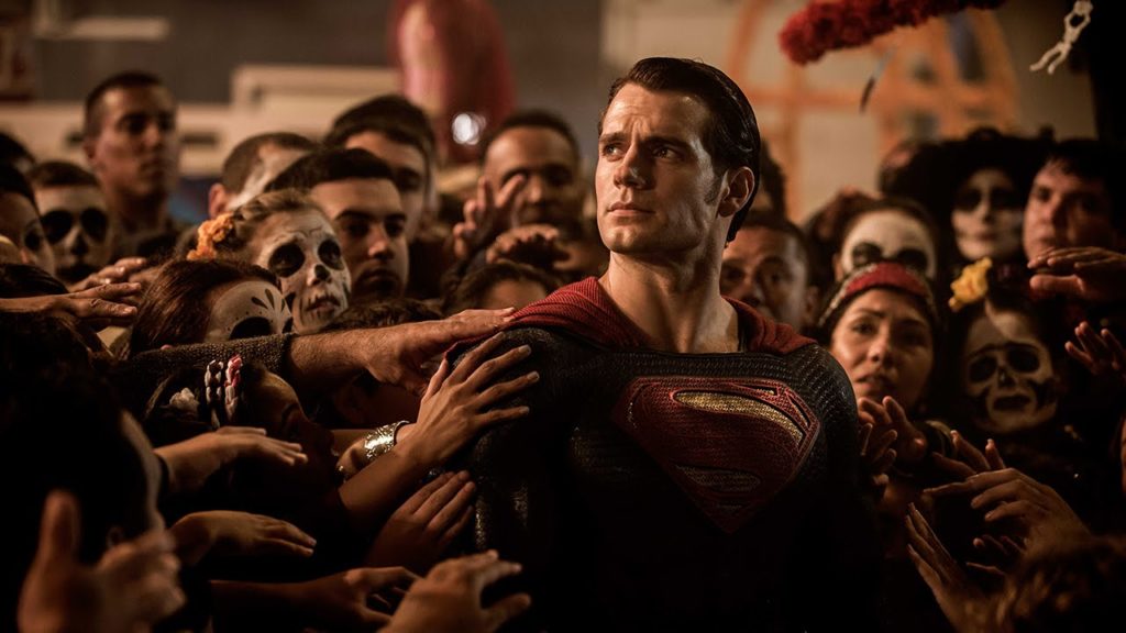 Superman (Henry Cavill) is treated as a deity by a grateful human crowd in Batman v Superman: Dawn of Justice (2016).