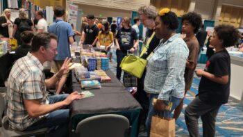 Mike Nawrocki visits with fans at Realm Makers Bookstore in Orlando, Fla., May 27, 2022